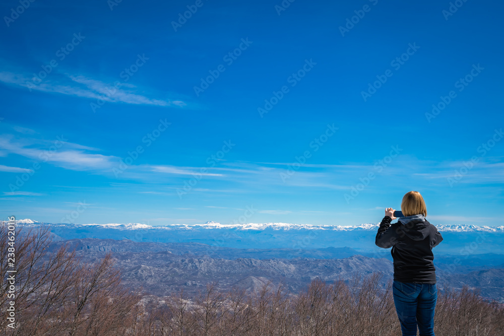 Girl photographing Lovcen National Park