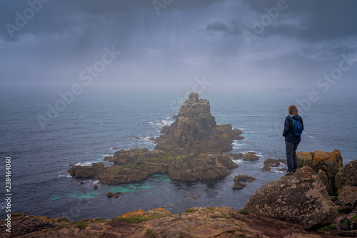 Woman on the cliff in Lands End
