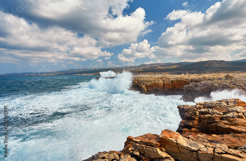 Waves beat on the rocky shore, Mediterranean Sea. photo