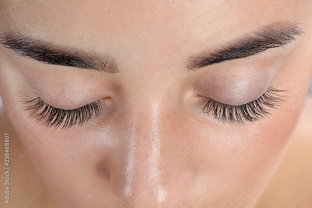 Fototapeta premium Young woman with beautiful eyelashes, closeup view