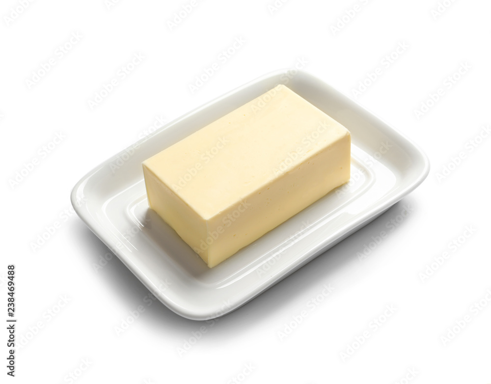 Ceramic dish with block of fresh butter on white background Ceramic dish with block of fresh butter on white background