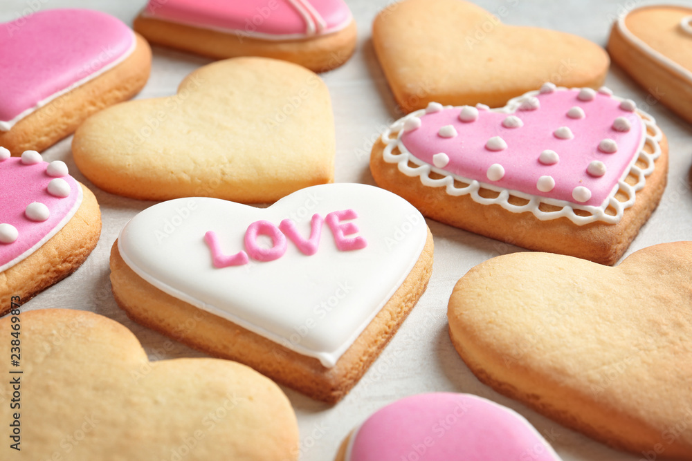 Decorated heart shaped cookies on table. Valentine's day treat Decorated heart shaped cookies on table. Valentine's day treat