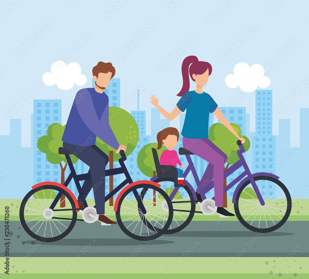 parents in bicycle with daughter on the park parents in bicycle with daughter on the park