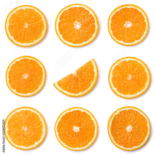 Seamless pattern of orange fruit slices. Orange slices isolated on white background. Food background. Flat lay, top view.