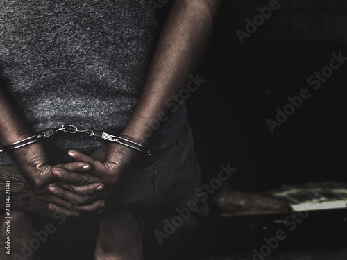 Law and police concept. Arrest drug trafficker with handcuffs.