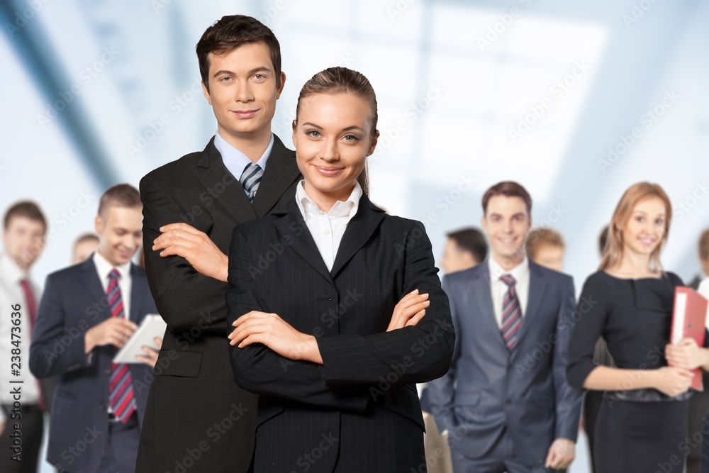Confident young Business couple with crossed hands on background Confident young Business couple with crossed hands on background