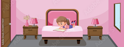 A girl reading book in bed