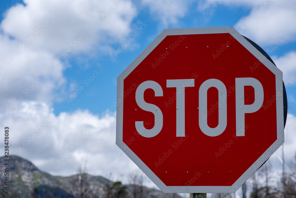 stop sign against blue sky