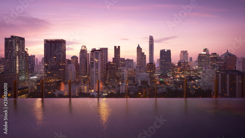 Wallpaper Mural Cityscape sunset view of Bangkok modern office business building and high skyscraper in business district with infinity view swimming pool at Bangkok,Thailand. Torontodigital.ca