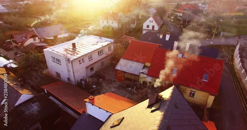 Camera flight over a Czech village in winter. Local heating is important source of emissions. Air pollution and climate change theme. Sustainable development and ecology in European Union.
