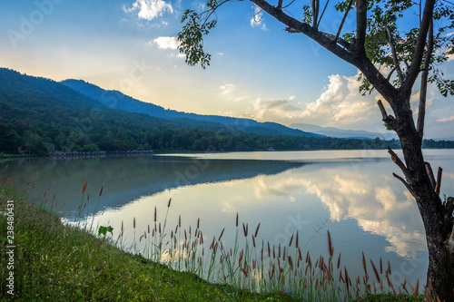 Scenic view of the reservoir Huay Tueng Tao with Mountain range forest at evening sunset in Chiang Mai, Thailand photo