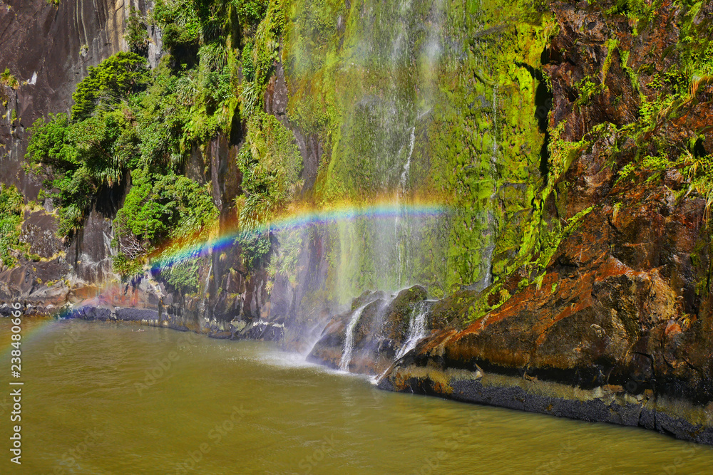 Naklejka premium Rainbow from a cascading waterfall