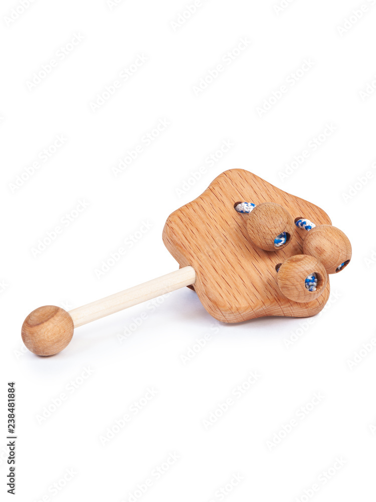 Photo of wooden rattles in the shape of a star on a white isolated background for a baby. Photo of wooden rattles in the shape of a star on a white isolated background for a baby.
