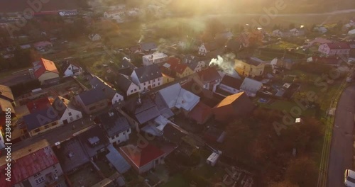Camera flight over a Czech village in winter. Local heating is important source of emissions. Air pollution and climate change theme. Sustainable development and ecology in European Union.