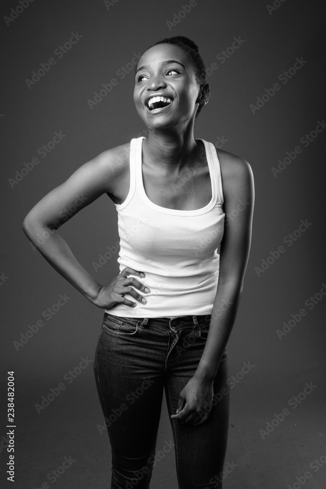 Young beautiful African Zulu woman laughing in black and white Young beautiful African Zulu woman laughing in black and white