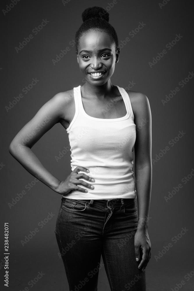 Young beautiful African Zulu woman smiling in black and white Young beautiful African Zulu woman smiling in black and white