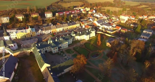 Camera flight over The Manetin town. It is baroque landmark in Western Bohemia. Amazing destination in Central Europe. photo