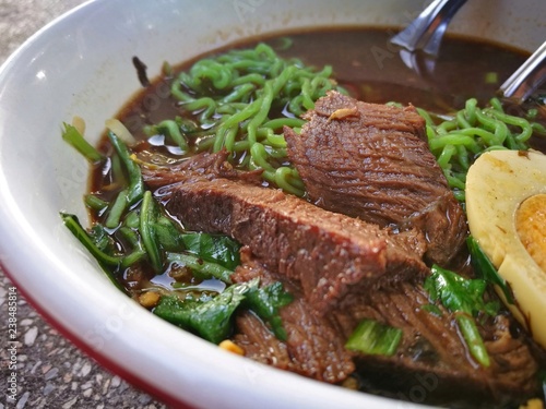 Thai beef noodle with egg , morning glory and green rice vermicelli 