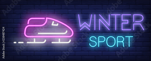 Winter sport neon sign. Glowing inscription with pink bobsleigh on brick wall background. Vector illustration can be used for sport, competition, bobsleigh