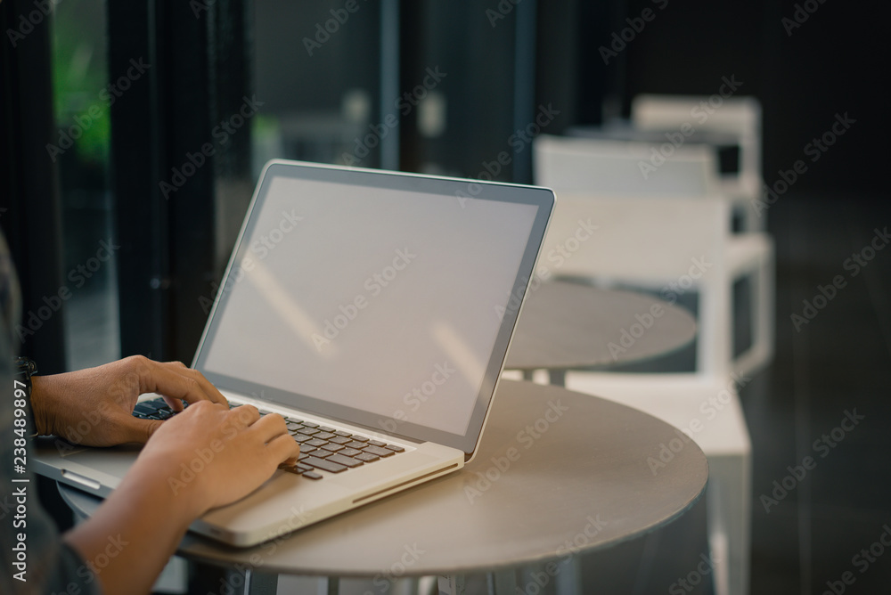 Business man using laptop computer typing in coworking center working,copy space. Business man using laptop computer typing in coworking center working,copy space.