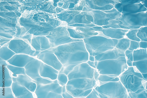 Texture of water in swimming pool for background