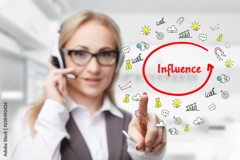 Technology, internet, business and marketing. Young business woman writing word: Influence Technology, internet, business and marketing. Young business woman writing word: Influence