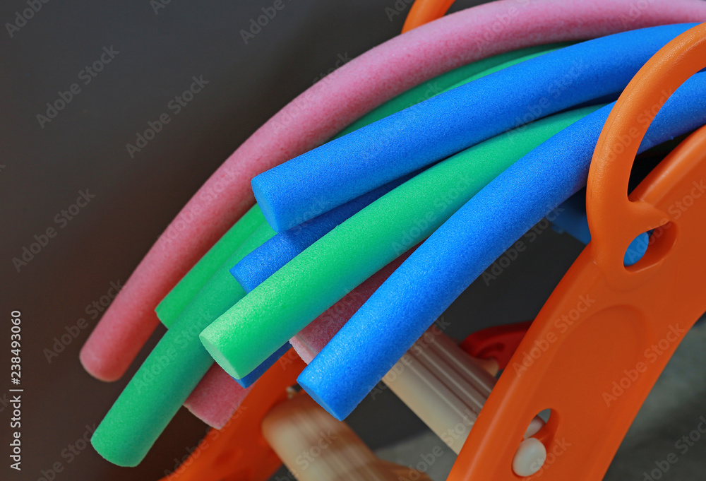 Water aerobic equipment. colored aqua noodles Water aerobic equipment. colored aqua noodles