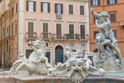 Closeup view of the Fountain of Neptune located at the empty north end of the Square Navona (Piazza Navona) in Rome. Italy. All potential trademarks are removed.