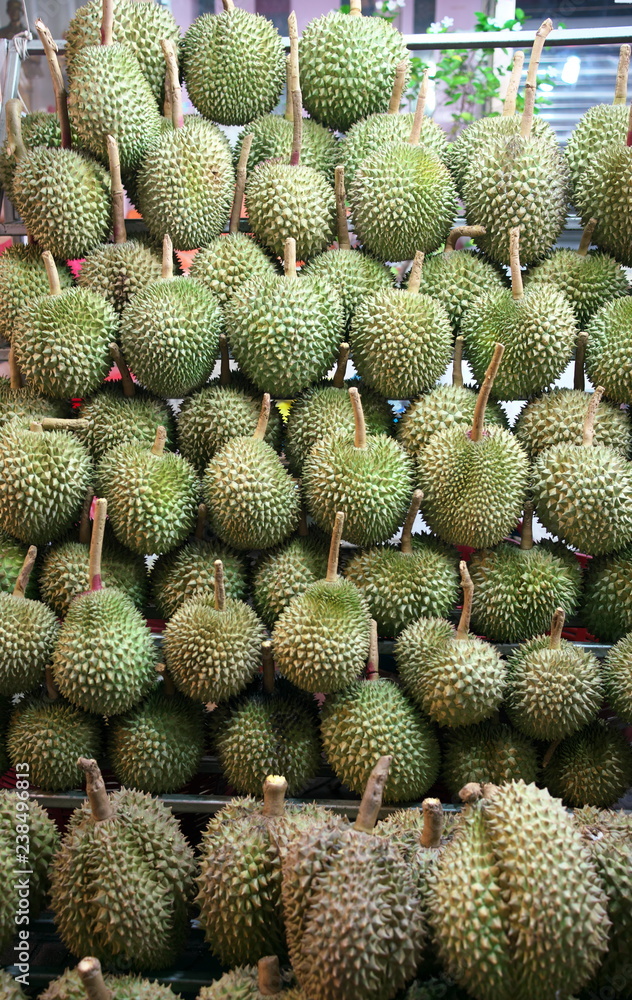 Bangkok,Thailand-December 7, 2018: Durians sold by street vendor at China Town, Yaowarat, at night in Bangkok Bangkok,Thailand-December 7, 2018: Durians sold by street vendor at China Town, Yaowarat, at night in Bangkok