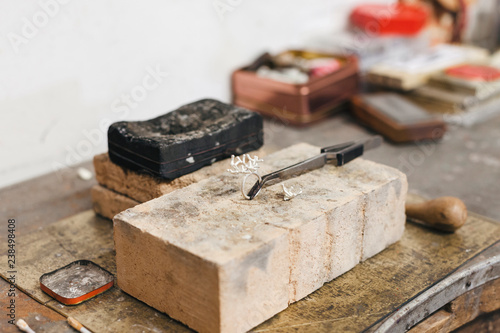 Wallpaper Mural High angle view of ring with hand tools on wooden table in workshop Torontodigital.ca