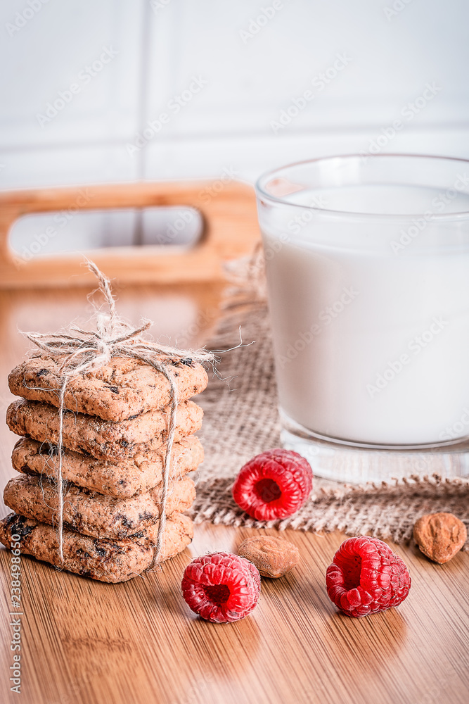 Oatmeal cookies with raspbarry and milk in a glass, healthy snac Oatmeal cookies with raspbarry and milk in a glass, healthy snac