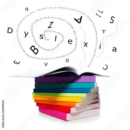 Scatteret letters flying from books and word dyslexia photo