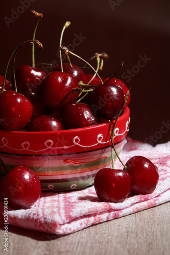 A bowl with ripe cherry	