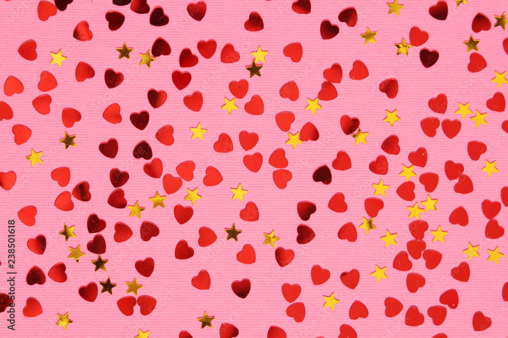 Pink background with red confetti hearts for Valentine Day Pink background with red confetti hearts for Valentine Day