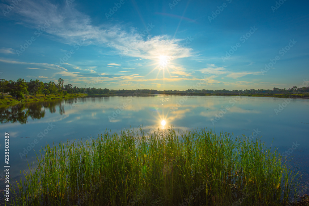 Sunset on lake in the summer , Evening sky Landscape Backgrounds Sunset on lake in the summer , Evening sky Landscape Backgrounds
