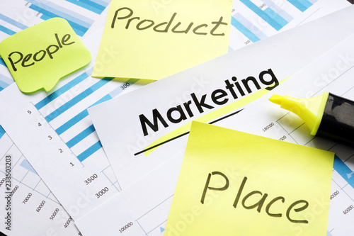 Marketing report and sticks with words Product People Place Promotion.