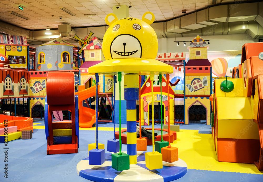 Obraz premium Modern children playground indoor with lot of colorful toys and obstacles