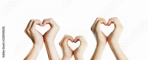 People's hands show a heart sign. Valentines day relationship concept. On isolated background