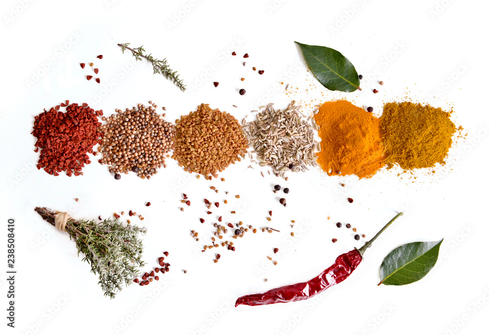 top view on heaps of indian powder spices with thyme and pepper on white  background Stock Photo | Adobe Stock
