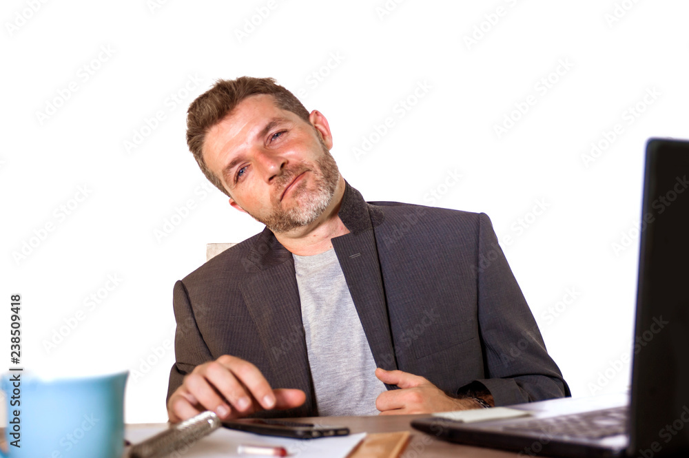 isolated portrait of young successful and attractive businessman working at office computer desk satisfied and relaxed in financial business success isolated portrait of young successful and attractive businessman working at office computer desk satisfied and relaxed in financial business success