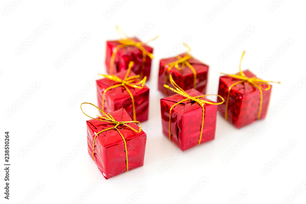Fototapeta premium Christmas red shiny gift boxes isolated on a white background with space for text