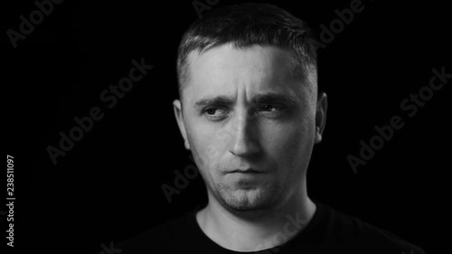 The man looking in camera