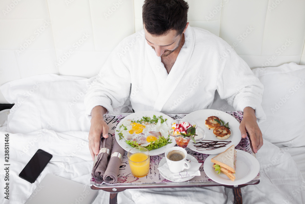 Breakfast in bed for bearded dark-haired sexy manly man