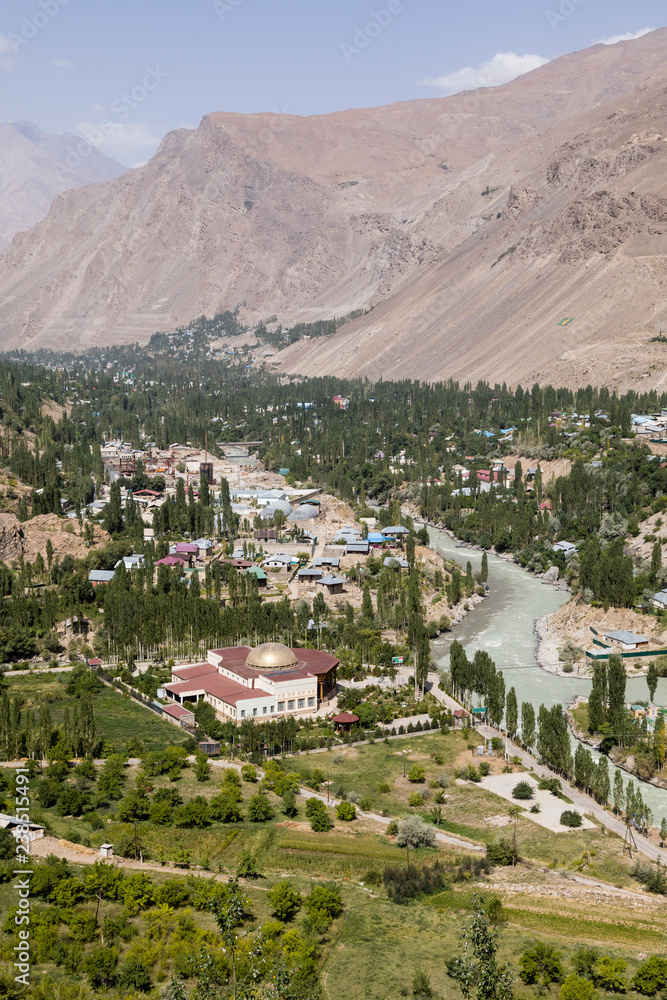 Gunt River with the city of Khorog in the Wakhan valley in Tajikistan with the Pamir mountains
