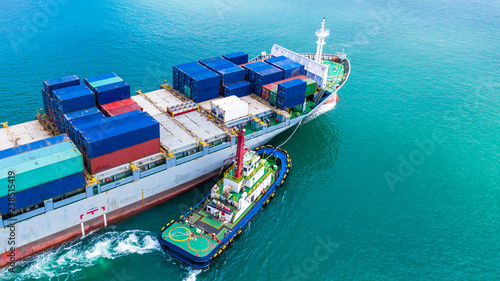 Aerial view container ship carrying container for import and export, business logistic and transportation by ship in open sea. photo