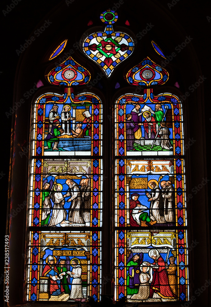  Colorful Stained Glass in medieval Sarlat Cathedral  dedicated to Saint Sacerdos. Sarlat la Caneda in Dordogne Department, Aquitaine, France