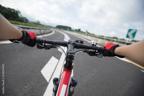 Cyclist riding Mountain Bike on highway