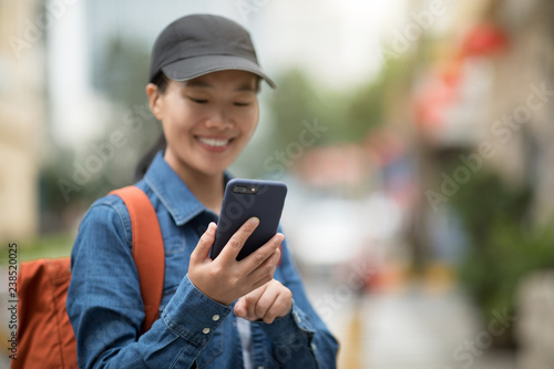 Woman using smartphone in city