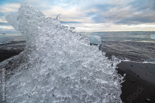 Crystal ice on black diamond beach, Iceland photo