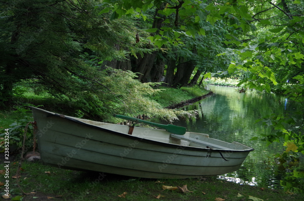 A boat at the pond in the park. A boat at the pond in the park.